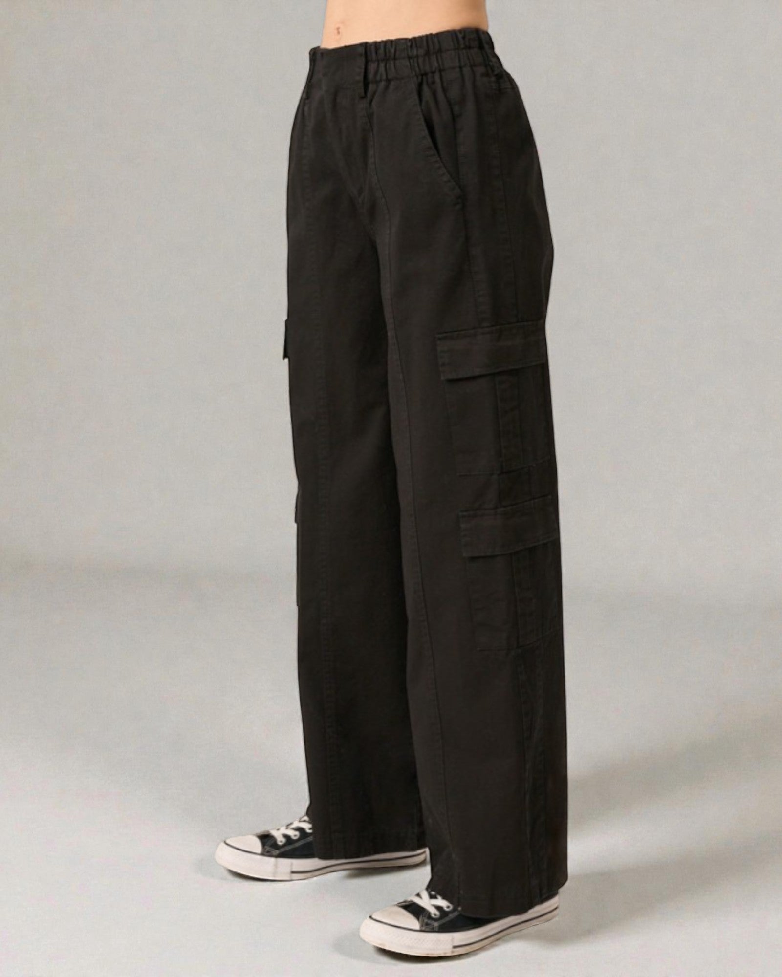 Black cargo pants on a gray background