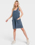 Woman wearing a blue denim dress on a white background