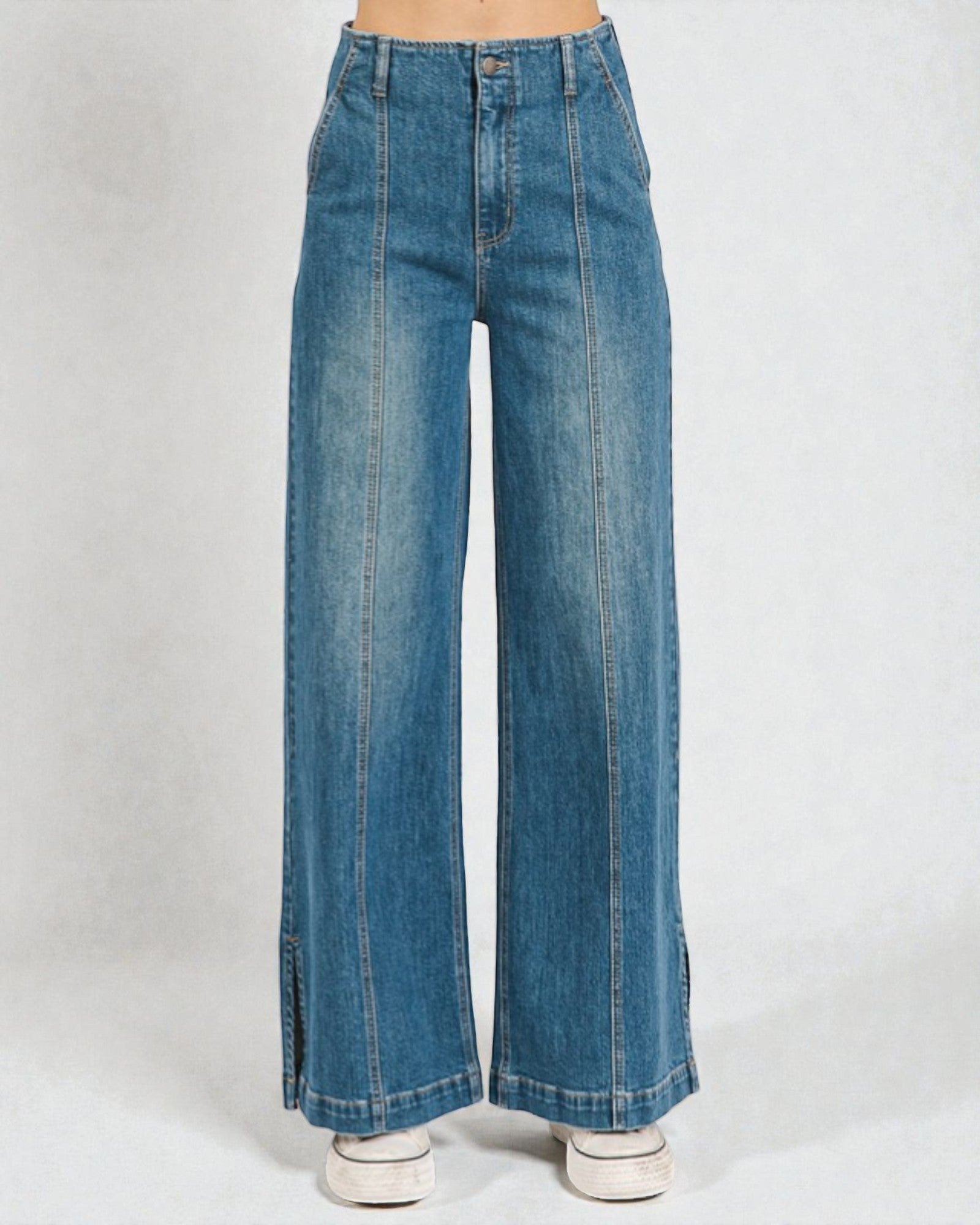 Blue wide-leg jeans on a white background