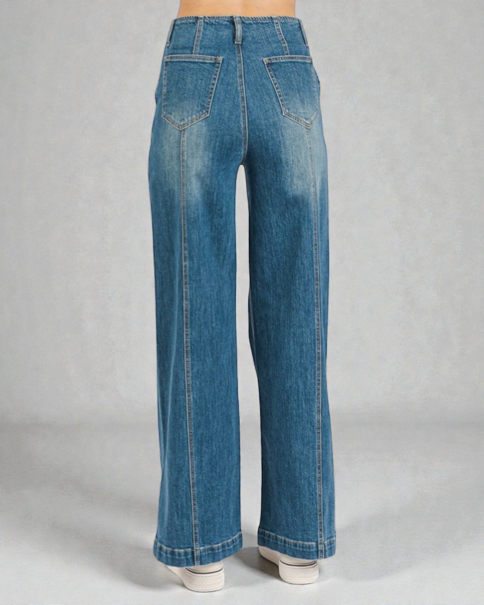 Blue jeans on a gray background