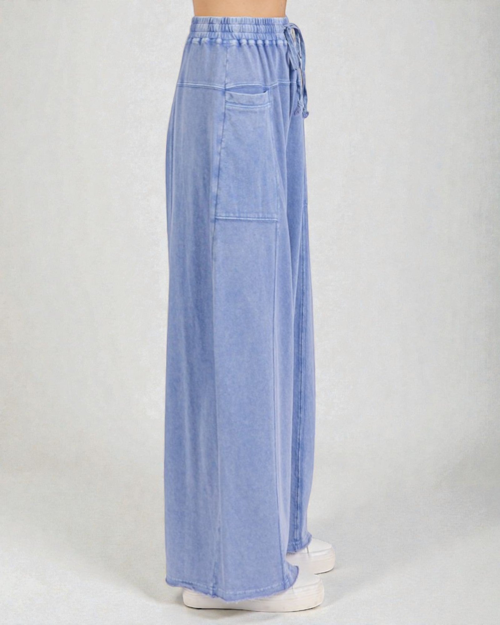 Light blue wide-leg pants on a white background