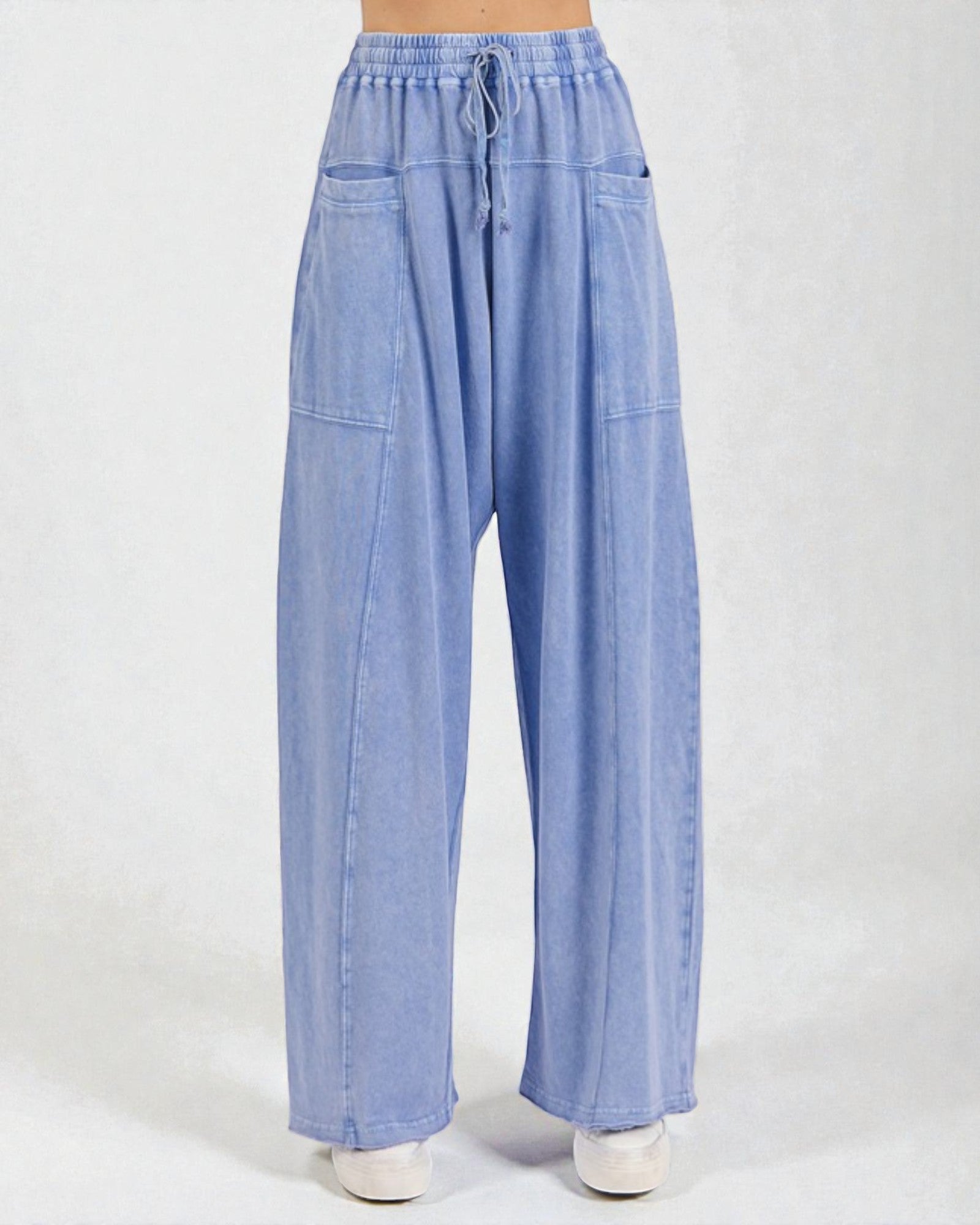 Light blue denim pants on a white background