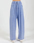 Light blue denim pants on a white background