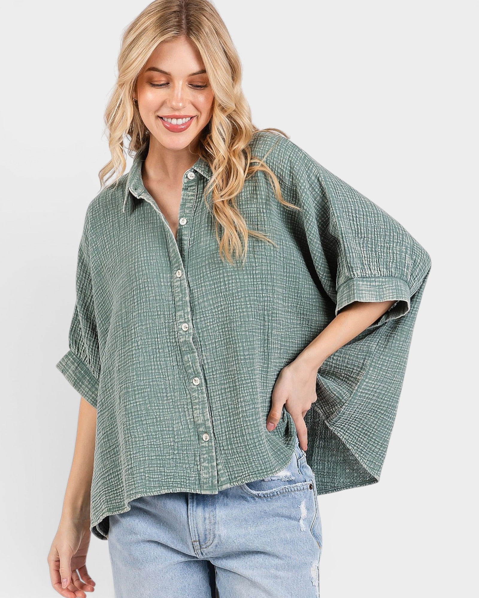 Woman wearing a green checkered shirt with short sleeves on a white background