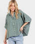 Woman wearing a green checkered shirt with short sleeves on a white background