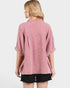 Person wearing a pink plaid shirt on a white background