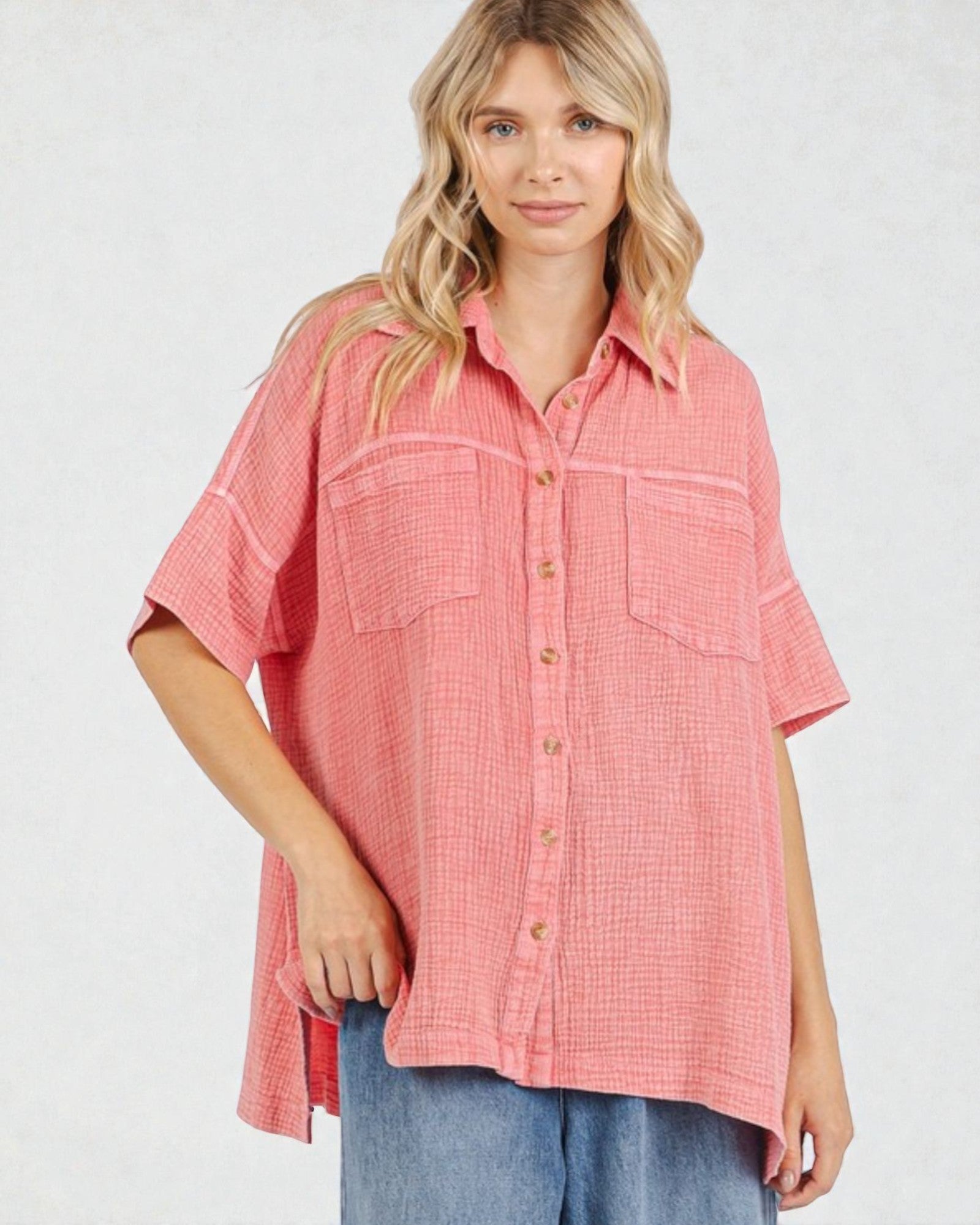 Woman wearing a pink checkered shirt on a white background