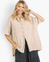 Beach Rose Co. sand cotton gauze oversized shirt with short sleeves, chest pockets, and a button-down front.