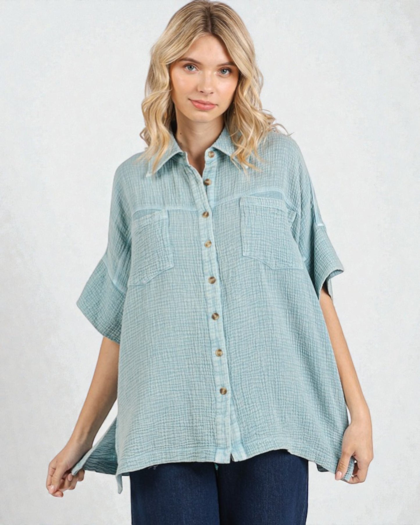Woman wearing a light blue checkered shirt on a white background