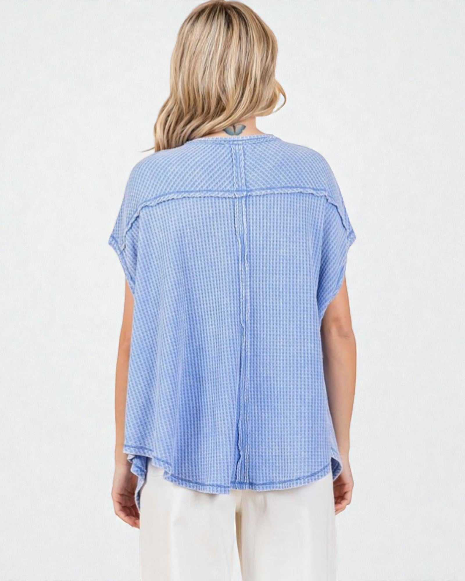 Woman wearing a blue checkered shirt on a white background