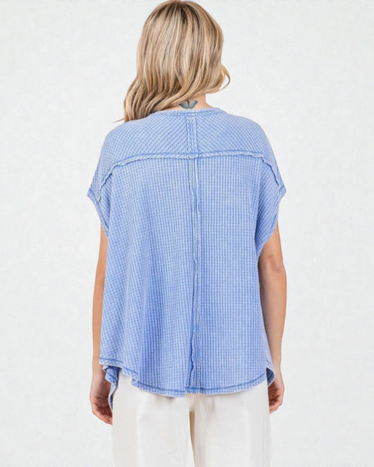 Woman wearing a blue checkered shirt on a white background