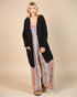 Cardigan long ouvert noir sur le devant