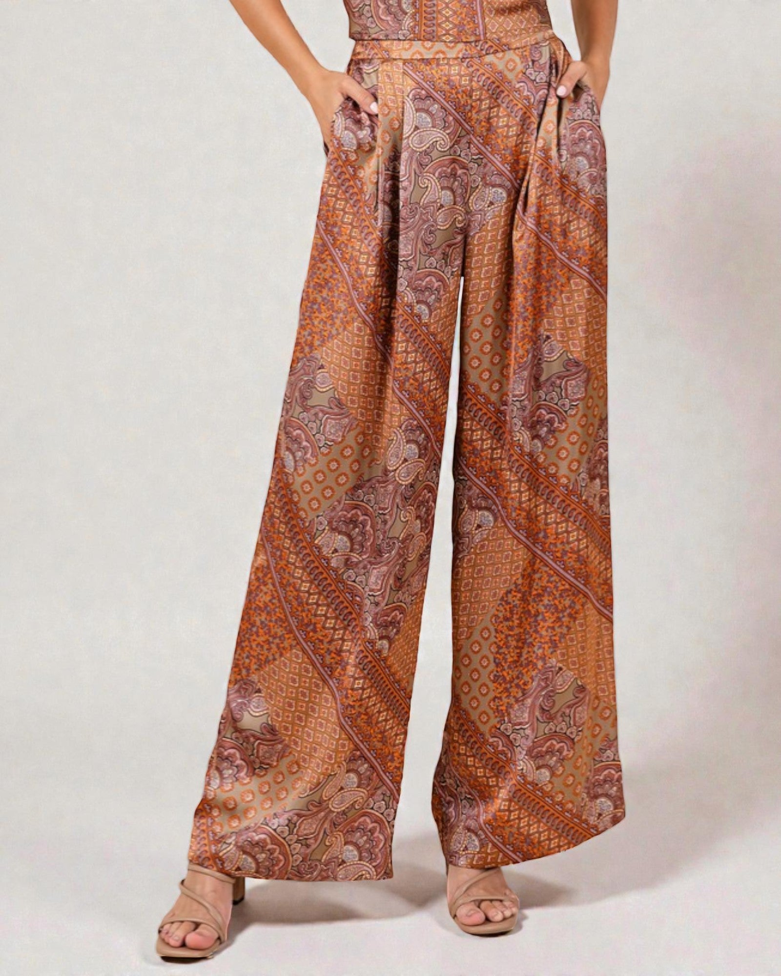 Patterned pants worn by a person on a plain background