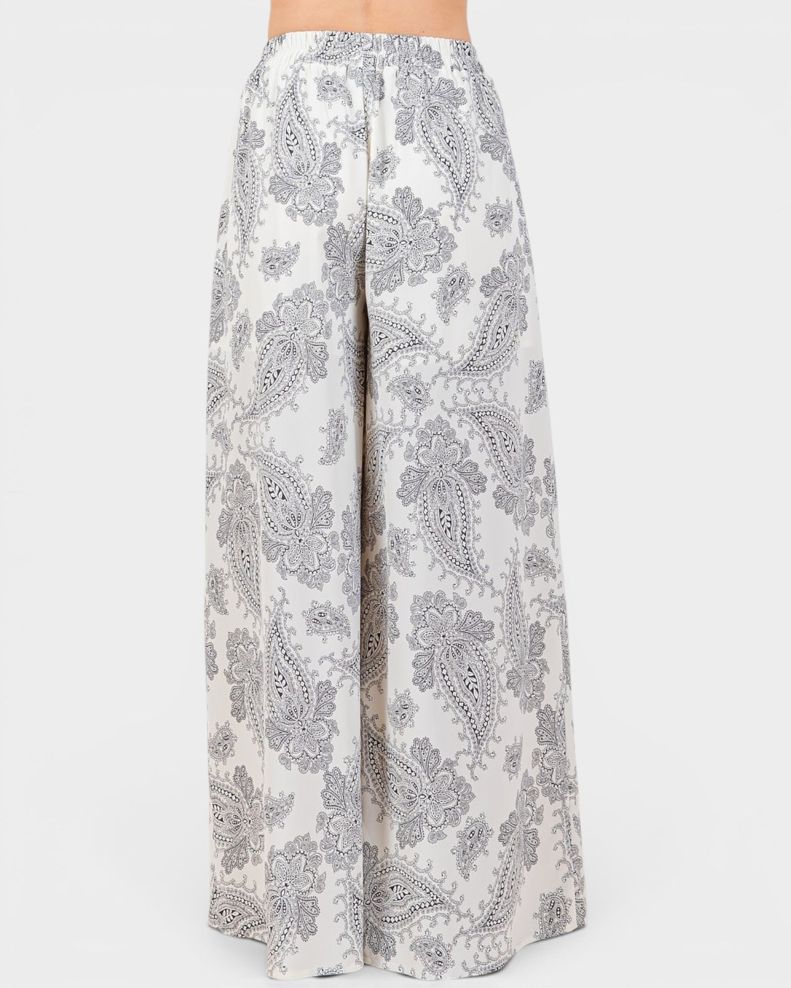 White pants with gray paisley pattern on a white background