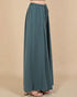 Teal wide-leg pants on a beige background