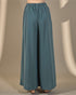 Teal wide-leg pants on a neutral background