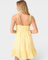 Yellow dress with thin straps on a white background