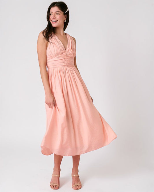 Woman wearing a pink dress on a white background