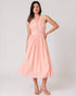 Woman wearing a pink dress on a white background