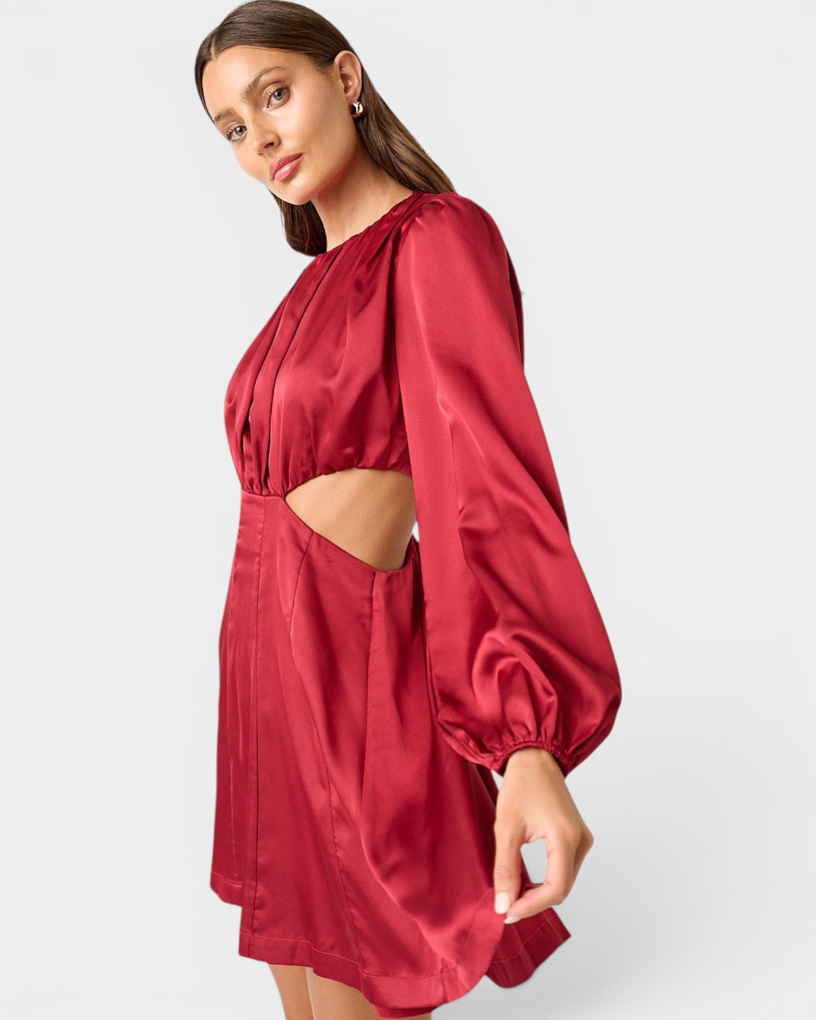 Red satin dress with cut-out design on a white background