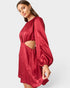 Red satin dress with cut-out design on a white background