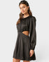 Woman wearing a black dress with cut-out design on a white background