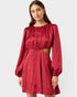 Red satin dress with cutout design on a white background