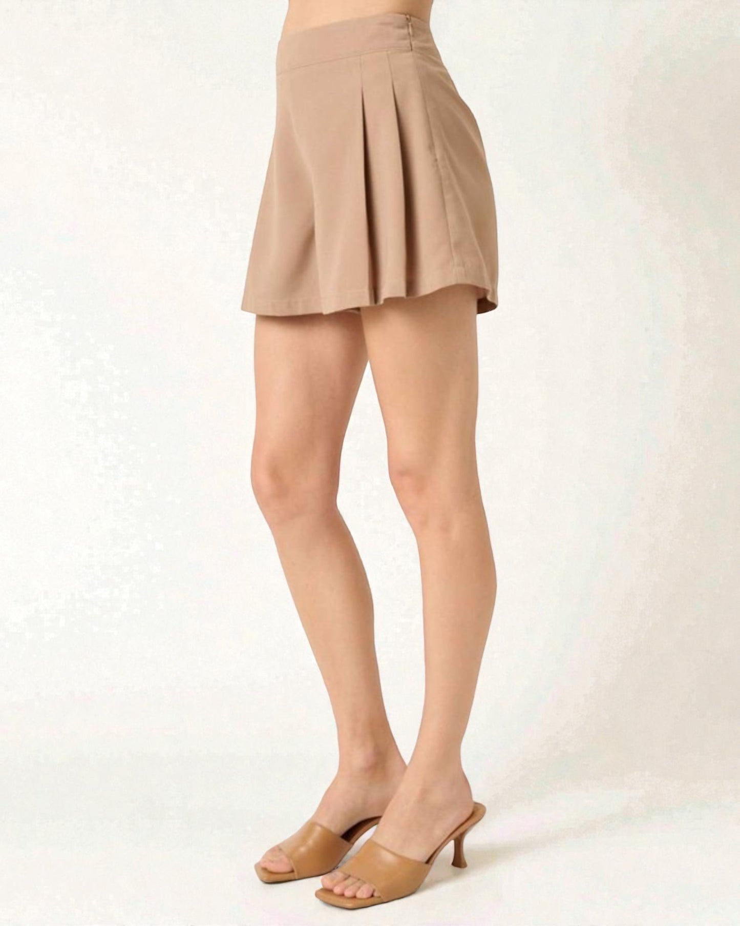 Beige shorts on a white background