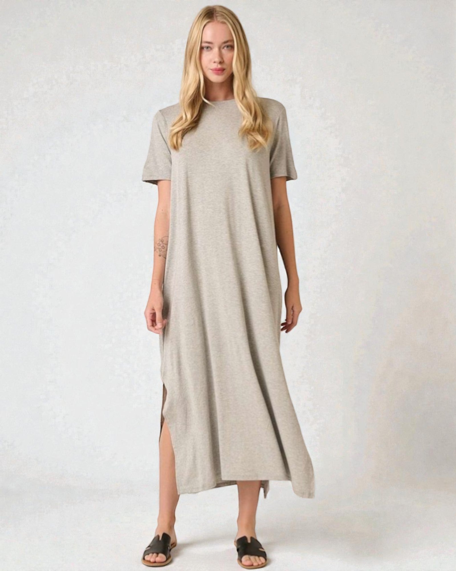 Woman wearing a beige dress on a white background