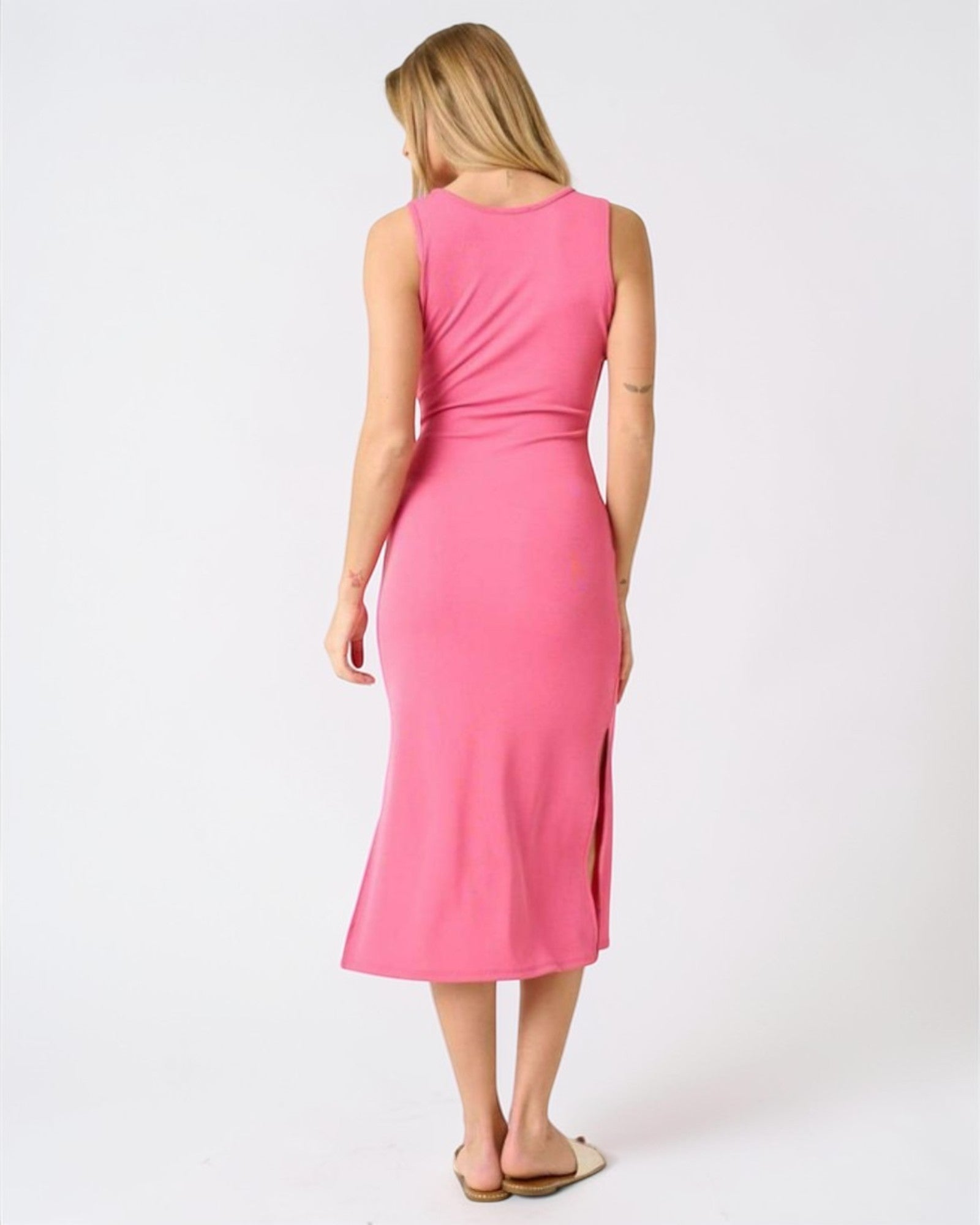 Woman wearing a pink dress on a white background