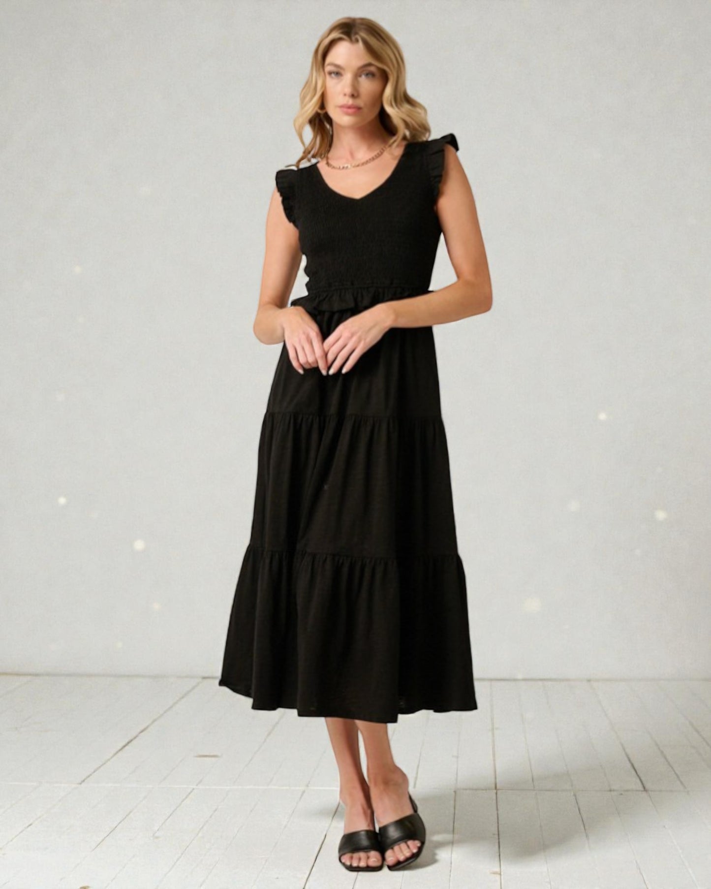 Woman wearing a black dress on a white background