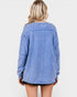 Blue denim jacket worn by a person on a white background