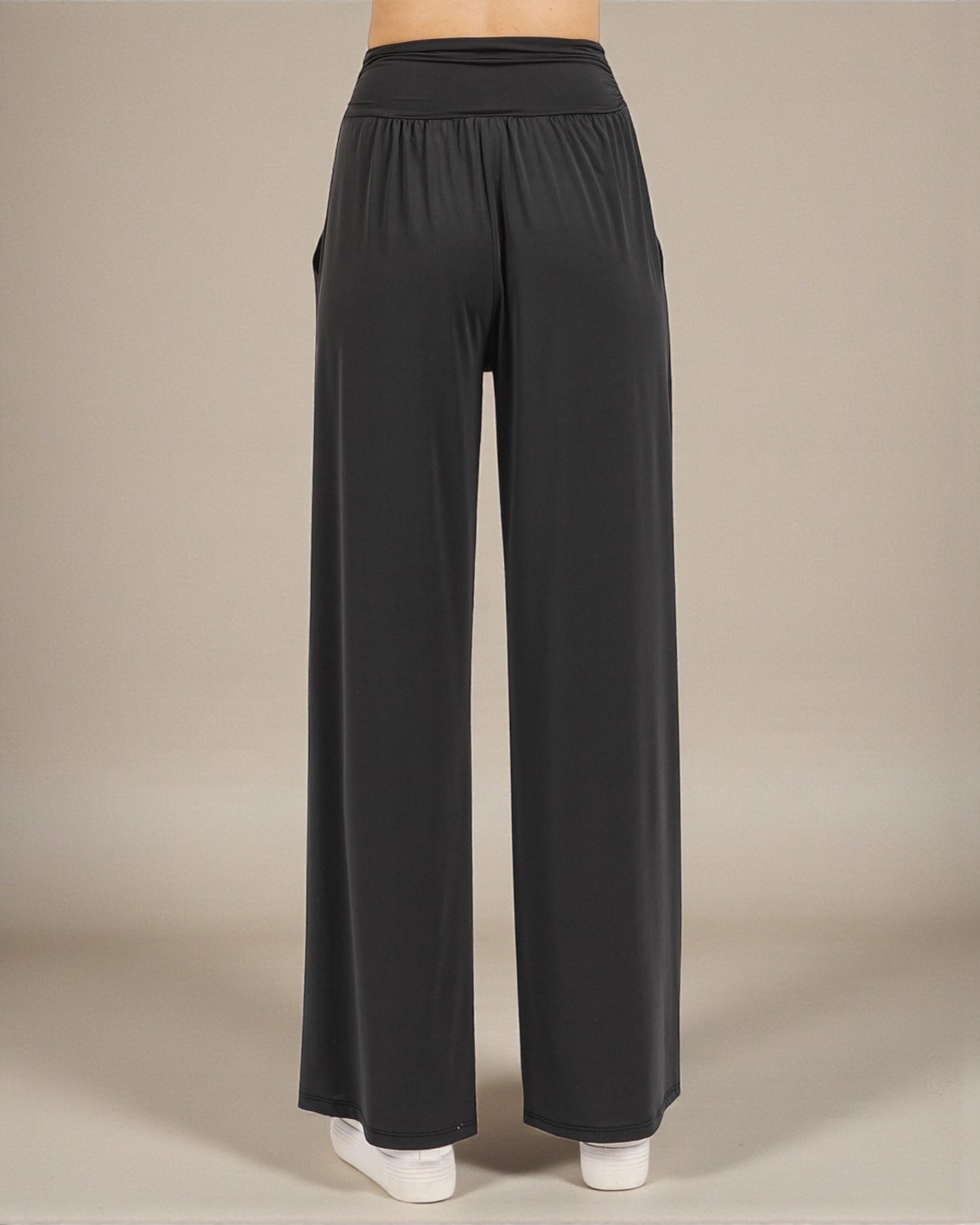 Black wide-leg pants on a neutral background