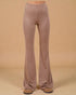 Mauve bell-bottom pants on a beige background