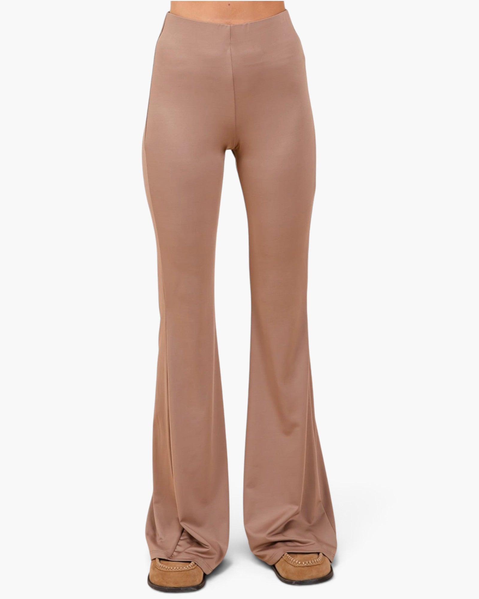 A pair of high-waisted, wide-leg flared pants in a dusty rose or mauve color, shown on a model from the waist down wearing tan loafers against a plain white background.