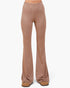 A pair of high-waisted, wide-leg flared pants in a dusty rose or mauve color, shown on a model from the waist down wearing tan loafers against a plain white background.