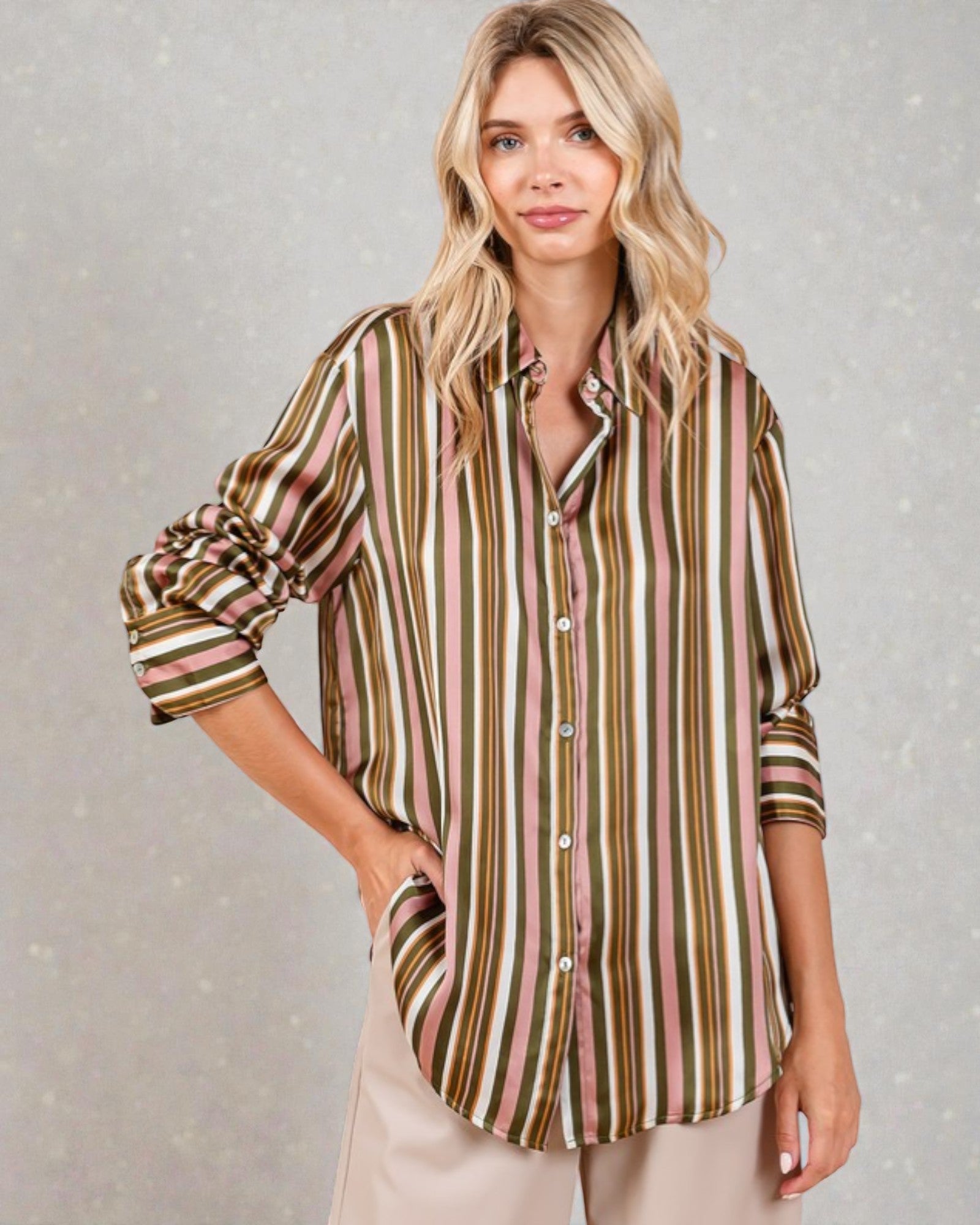 Woman wearing a striped shirt with a neutral background