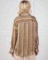 Person wearing a striped shirt with a white background
