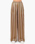 Wide-leg trousers with vertical stripes in brown, pink, beige, and white, shown on a model from the waist down against a plain white background.