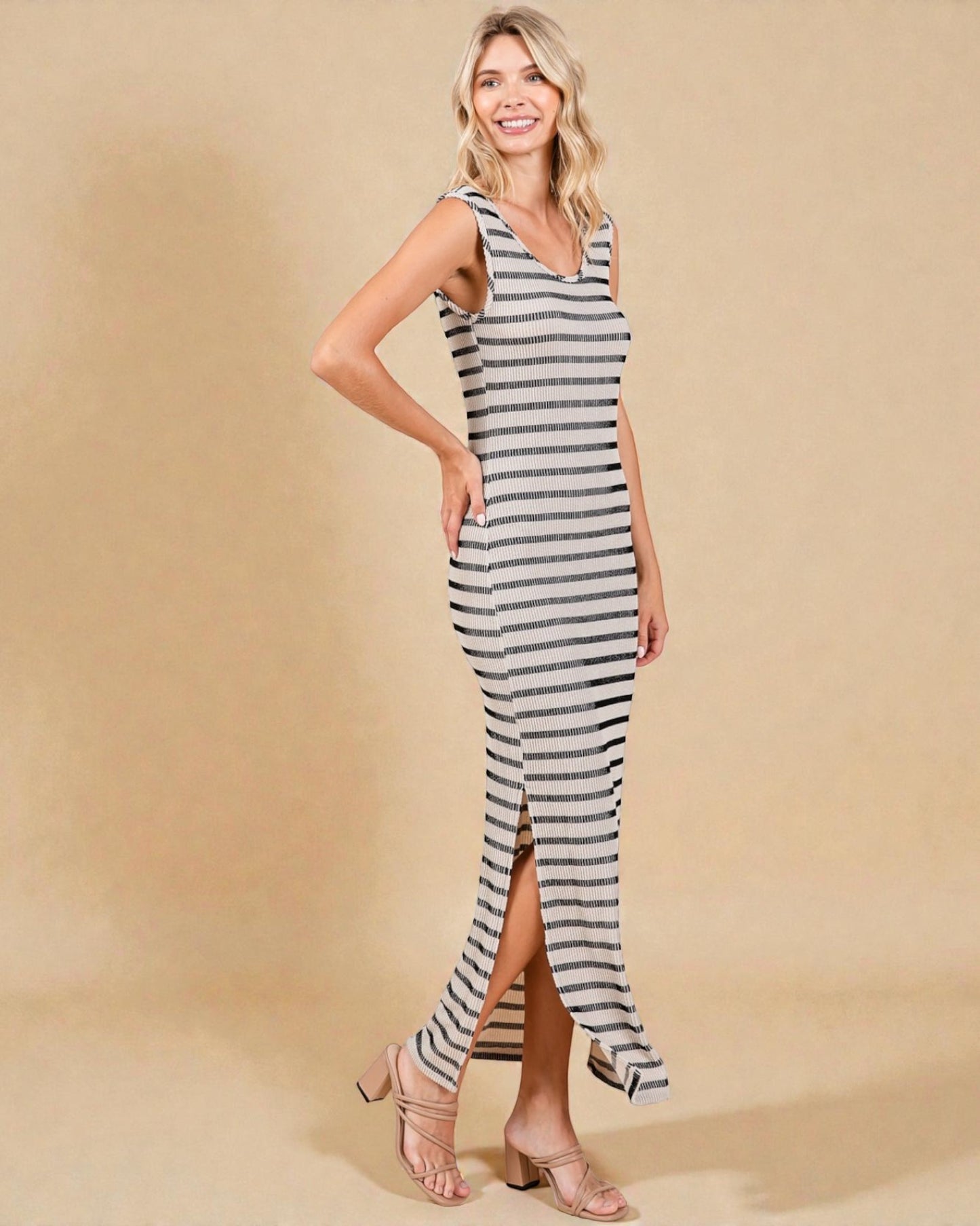 Woman wearing a striped dress on a beige background