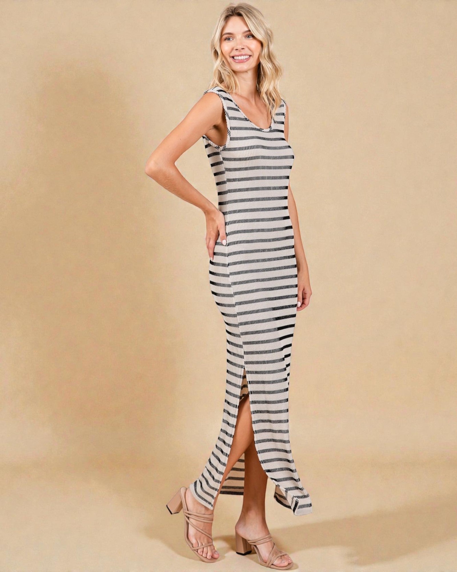 Woman wearing a striped dress on a beige background