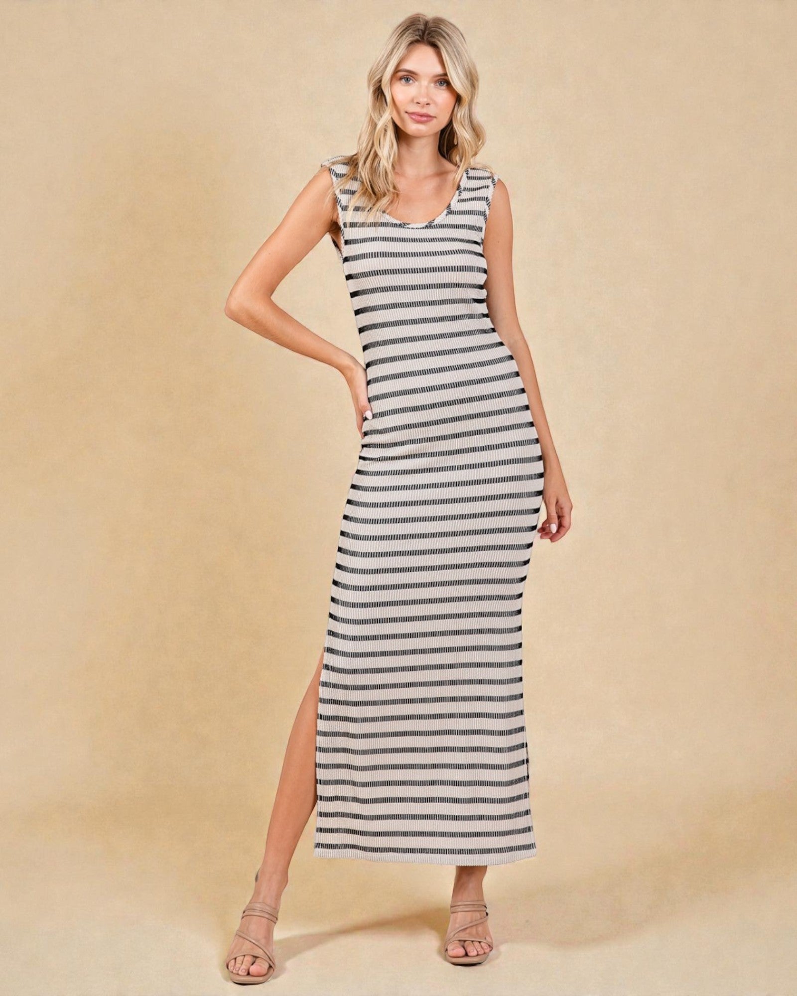 Woman wearing a striped dress on a beige background