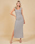 Woman wearing a striped dress on a beige background