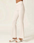 White pants worn by a person on a white background
