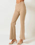 Beige flared pants worn by a person on a white background