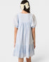 Light blue dress with puffed sleeves worn by a person on a white background