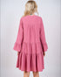 Pink dress with ruffled sleeves and layers on a white background