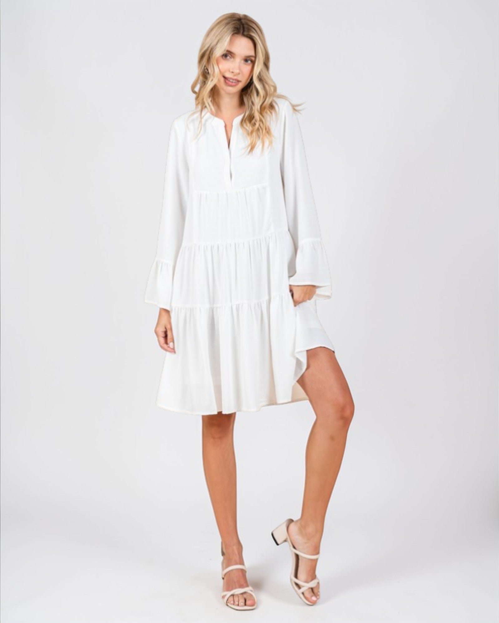 Woman wearing a white dress on a white background