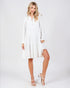 Woman wearing a white dress on a white background