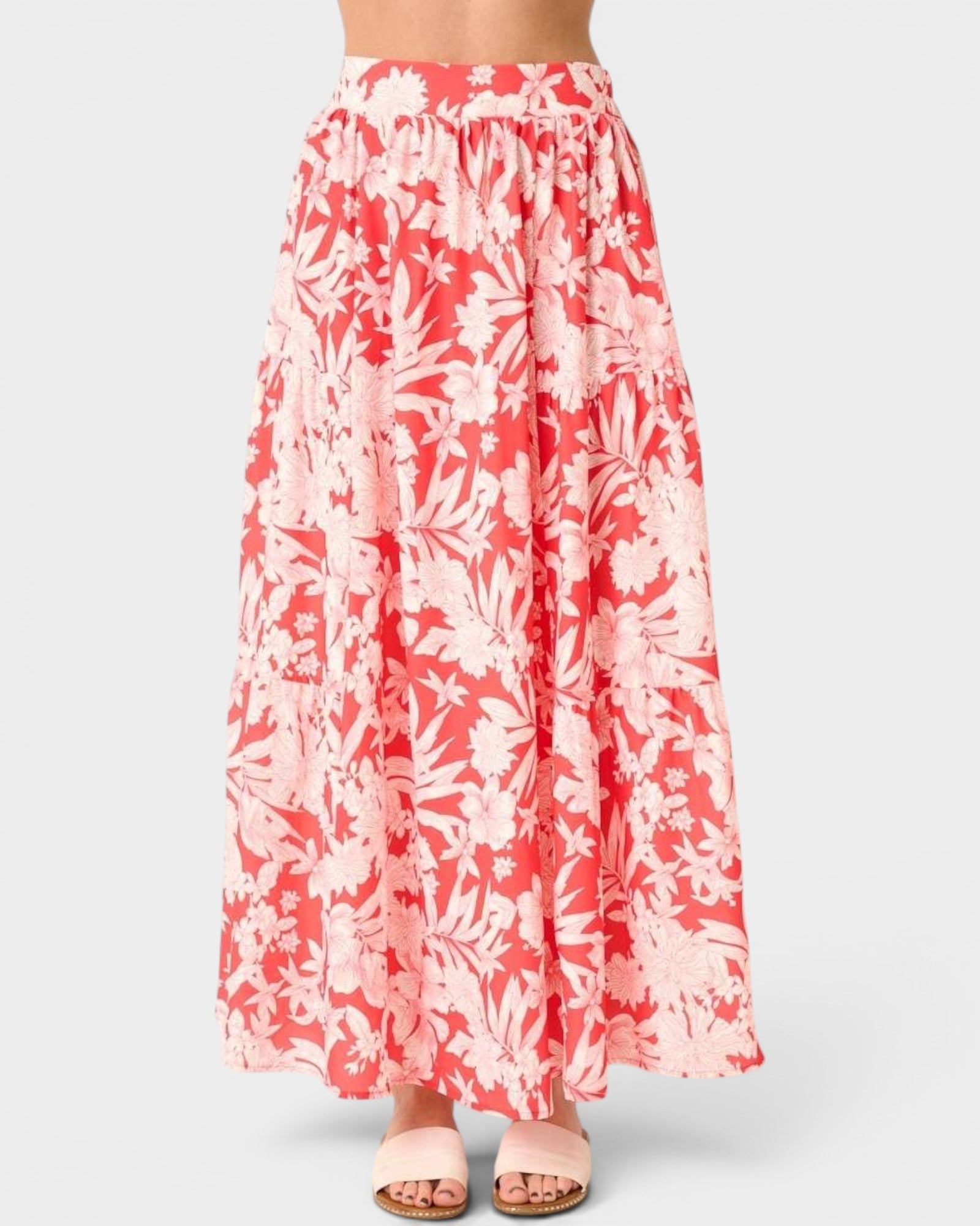 Floral patterned skirt with red and white colors on a plain background